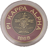 Pi Kappa Alpha fraternity coin in an AirTite holder